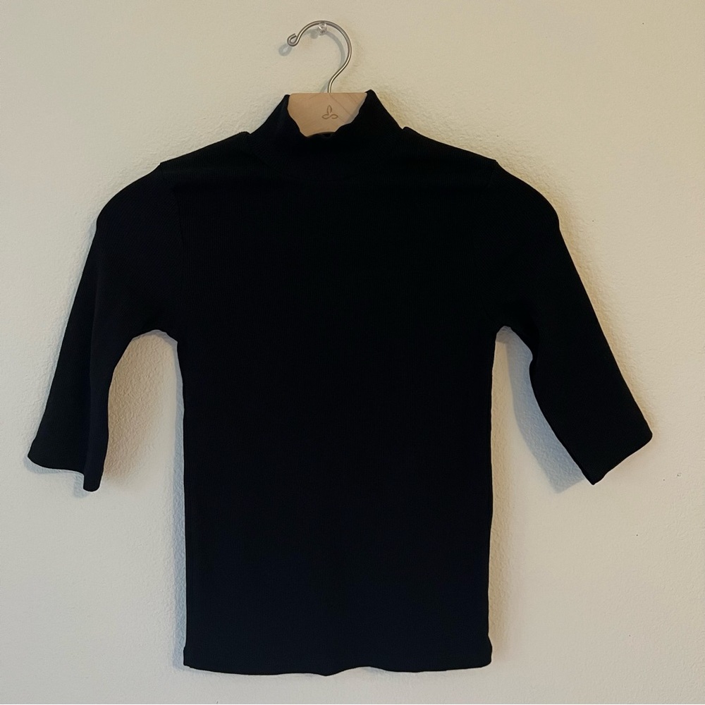 Zara black mock neck with elbow length sleeves. Fitted top.